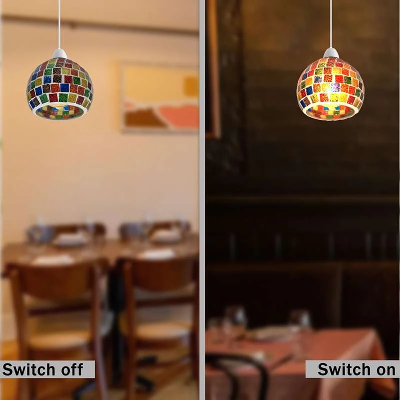 Mosaic table lamp with globe shape shade made of hand‑cut colored glass and mosaic tiles.