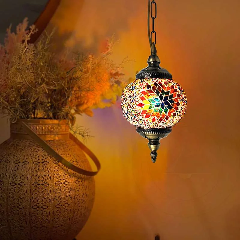 Turkish mosaic pendant light with hand‑cut multicolour glass globe on antique brass chain, 14cm diameter, 120cm height.