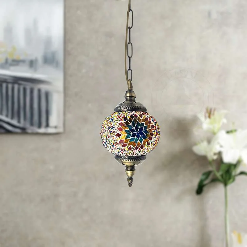 Turkish mosaic pendant light with 14 cm hand‑cut glass globe hanging from ornate antique brass chain