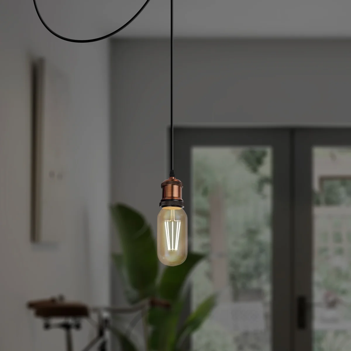 Yellow brass adjustable pendant light with metal and PVC body, 10cm wide, 2.5cm tall, hanging from a 95cm cable, dimmable.