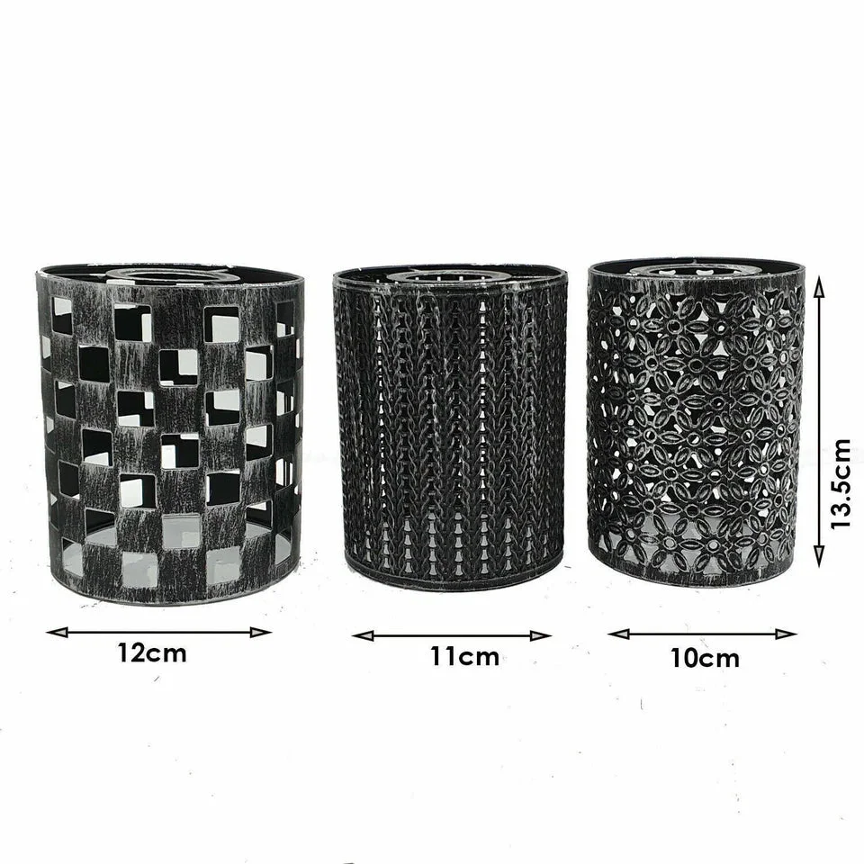 Black wall mounted lights with iron frame and textured shade, mounted on a wall, LED base visible but no bulb.