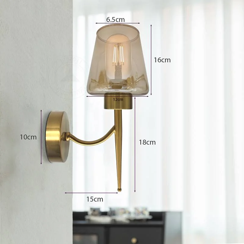 Modern wall light featuring amber glass shade and copper plate decorative element on metal base.