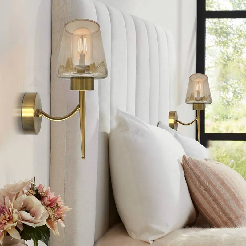 Amber glass wall light with antique brass copper plate and metal base, hanging on wall.