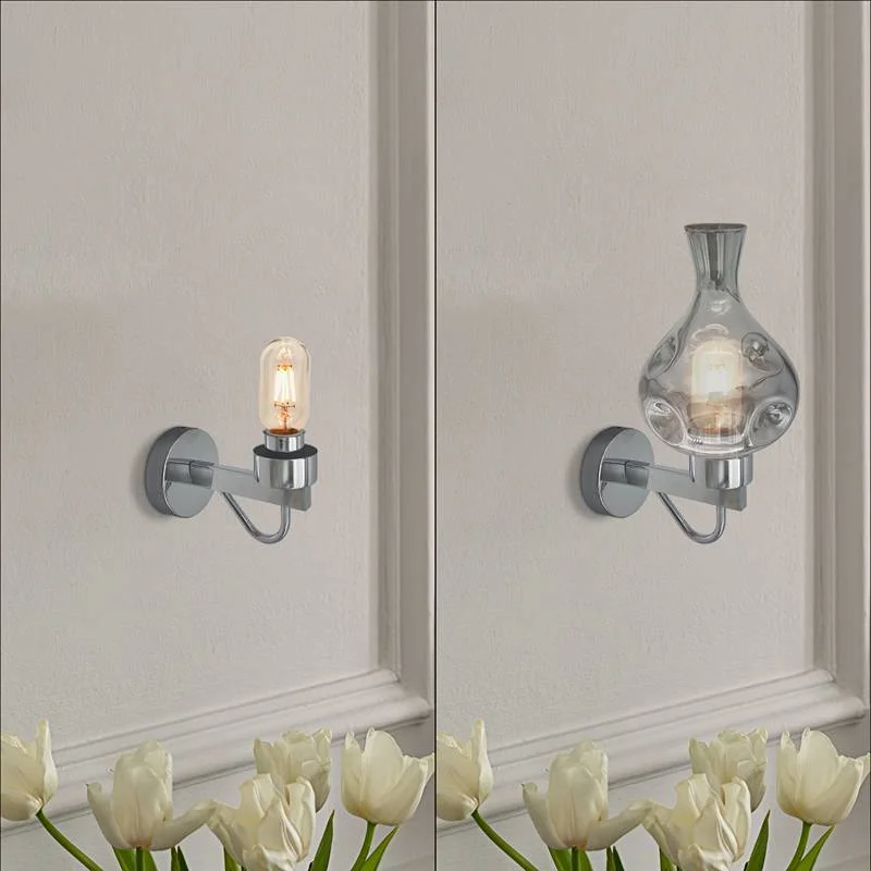 Industrial wall lamp with chrome base and smoked glass vase shade mounted on wall