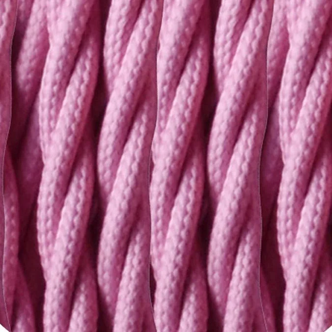 Twisted baby pink fabric cable coil, showing beige/blueish Italian braided outer and slender copper conductors.
