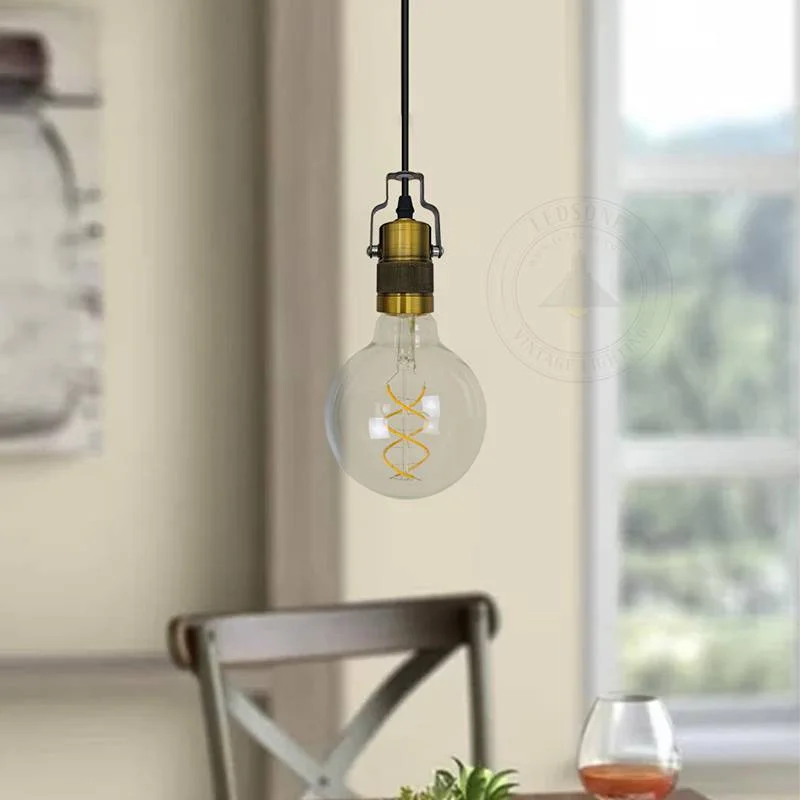 Yellow brass pendant light with retro vintage design hanging from a 95cm cable, featuring a round metal rose