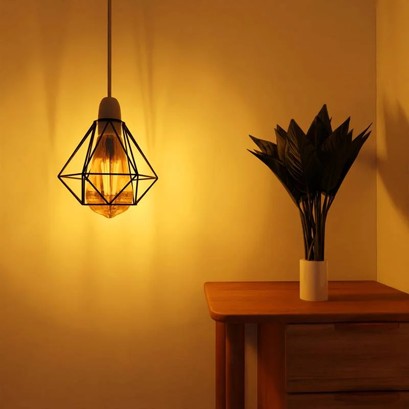 Geometric metal lampshade – black diamond wire cage protecting an E27 Edison bulb.
