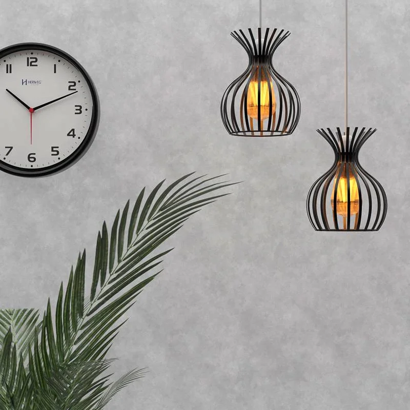 Black metal wire lampshade in vase shape hanging from ceiling, protective cage around bulb, modern industrial design.