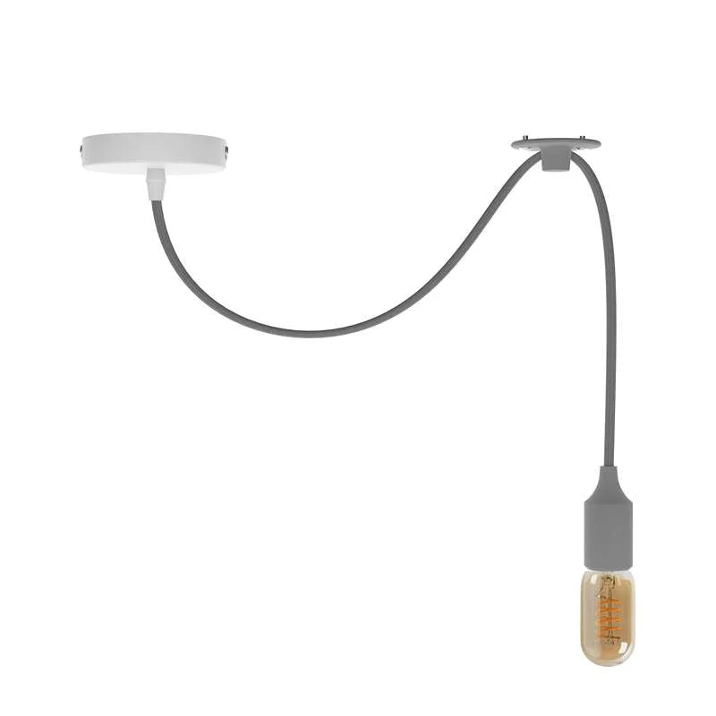 Adjustable pendant light with fabric cable and metal holder, vintage style, hanging from ceiling.