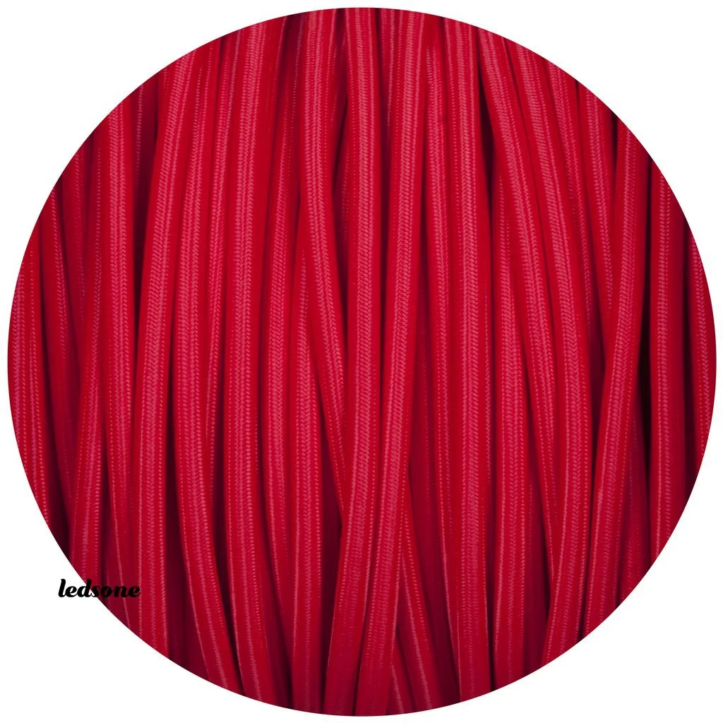 Red cloth‑covered twisted 2‑core cable, shown coiled and smooth, emblematic of a vintage lighting cable