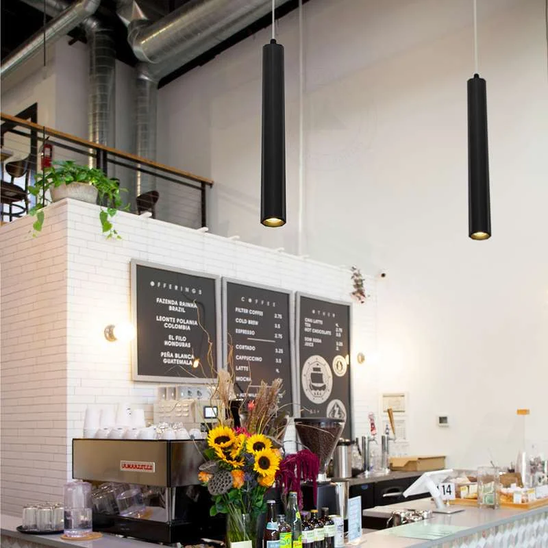 Adjustable height pendant: sleek aluminium LED cylinder light with a slim shade, hanging from a black or gold ceiling rose.