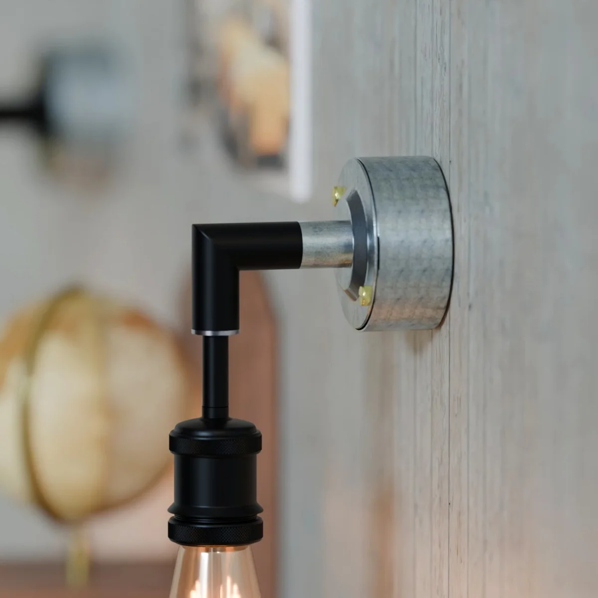 20mm malleable iron dome cover, galvanized steel finish, mounted on conduit cable for clean, durable look.