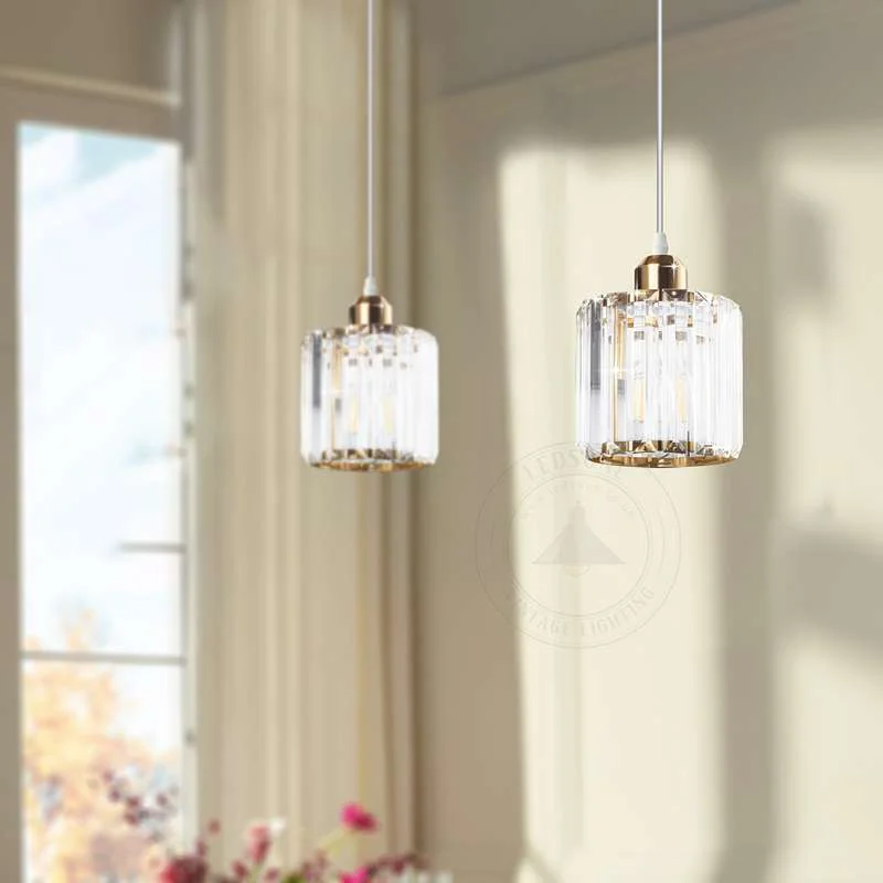 Round crystal pendant light with metal frame, crystal glass shade, chrome finish – a mini chandelier for kitchen island.