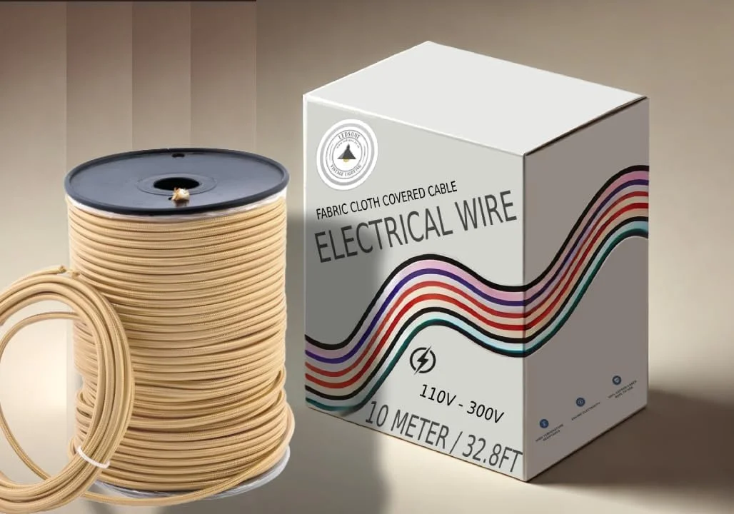 Gold braided round cable, textured fabric, 3‑core flexible lighting cable displayed on a flat surface.