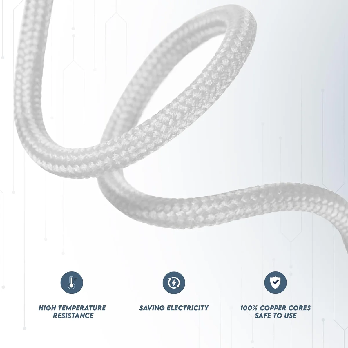 Gold fabric lighting cable with round braided finish, visible copper cores, laid on a wooden surface