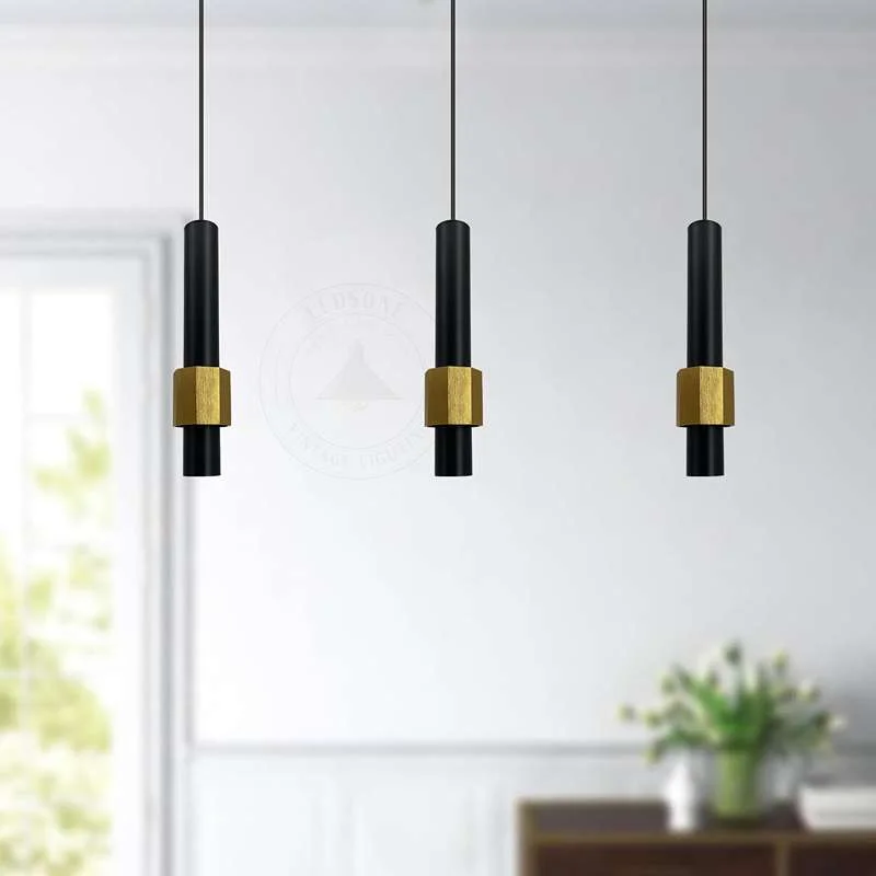 Contemporary ceiling light with black and gold aluminium shade, sleek cylindrical design, hanging from 95cm cable.