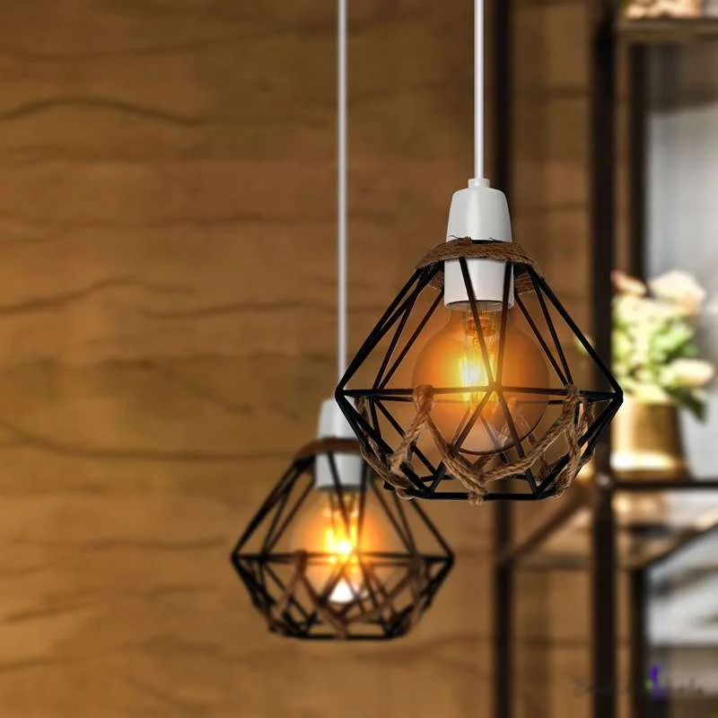 Black diamond‑shaped metal cage lampshade wrapped in hemp rope with a reducer ring for hanging.
