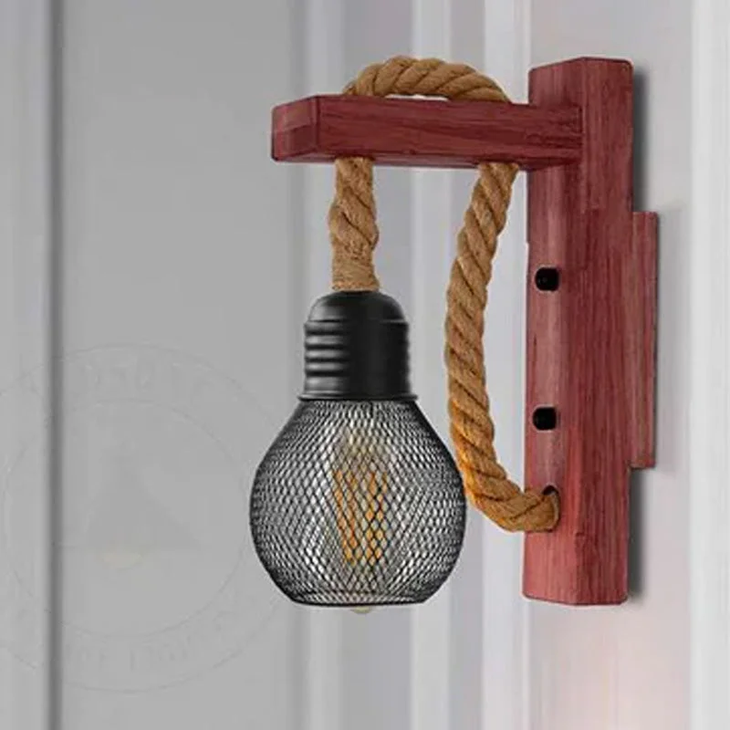 Rustic rope wall lights with hemp rope hanging from wooden base, black metal cage shade, vintage industrial style.