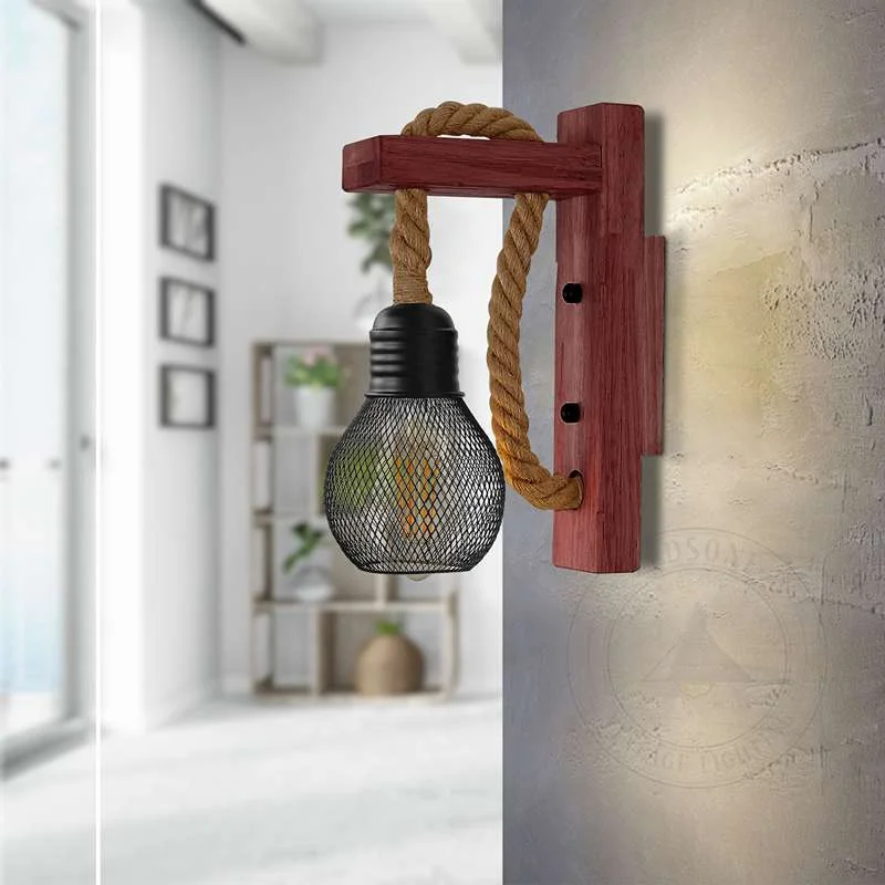 Dimmable E27 wall light with handwoven hemp rope, black metal cage, and natural wooden base, radiating warm vintage glow.
