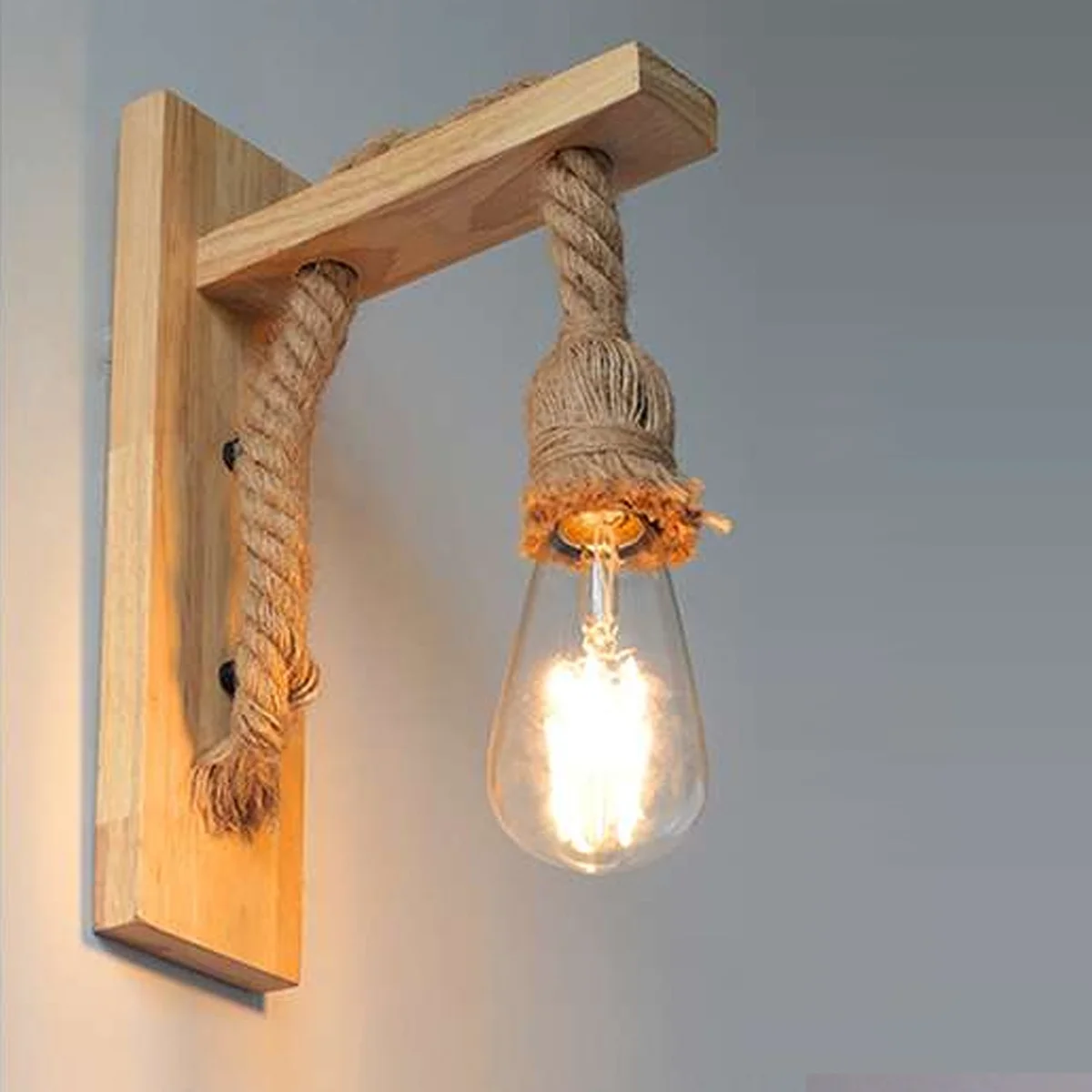 Rustic wooden rope wall lamp featuring solid wood frame and hand‑woven hemp rope, styled with vintage industrial charm.