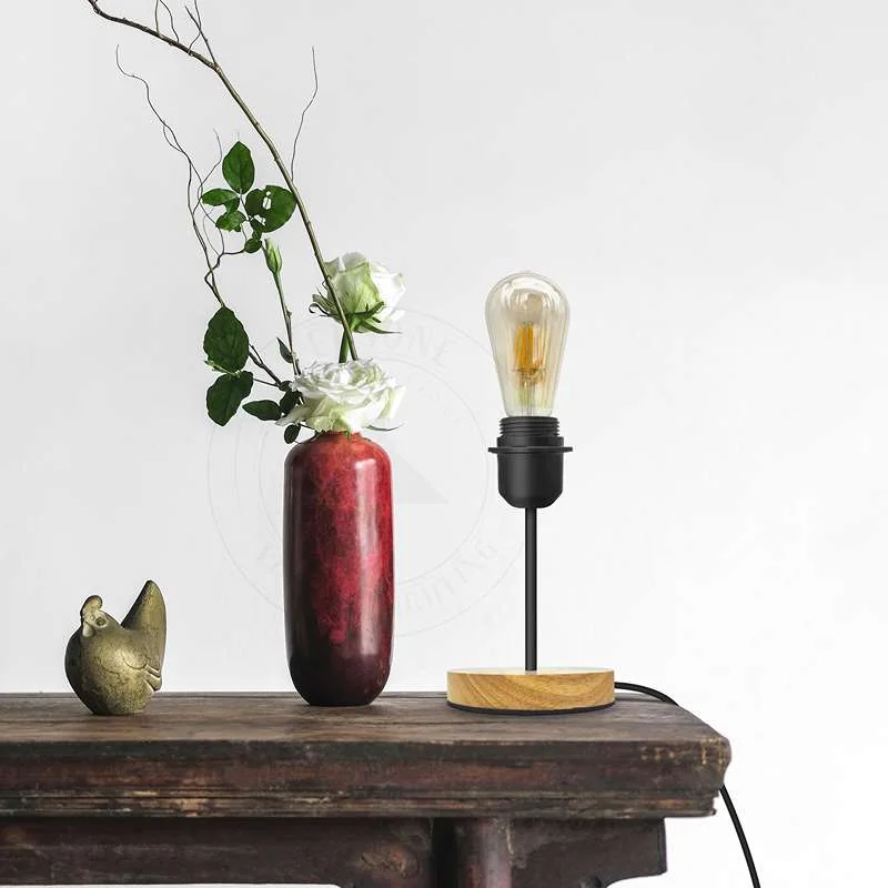 Black metal table lamp with a natural wood base lamp, featuring an E27 socket and on/off switch.