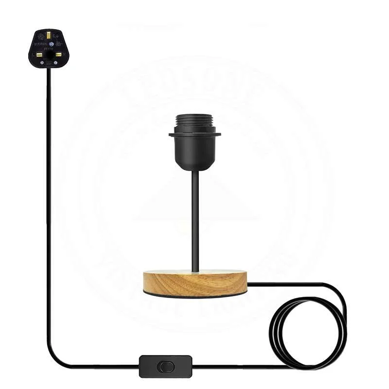 Vintage black table lamp with black metal holder on a natural wood base, industrial design.