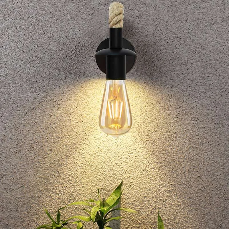 Vintage hemp rope wall light with adjustable metal arm, black E27 socket, hand‑woven hemp rope curling around the fixture.