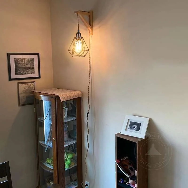 Retro wood and hemp rope plug‑in wall lamp with black diamond cage shade hanging from ceiling with 5m cord.