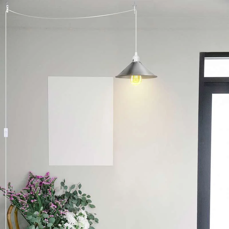 White plug in pendant light with metal and PVC housing, an E27 socket, hanging from the ceiling.