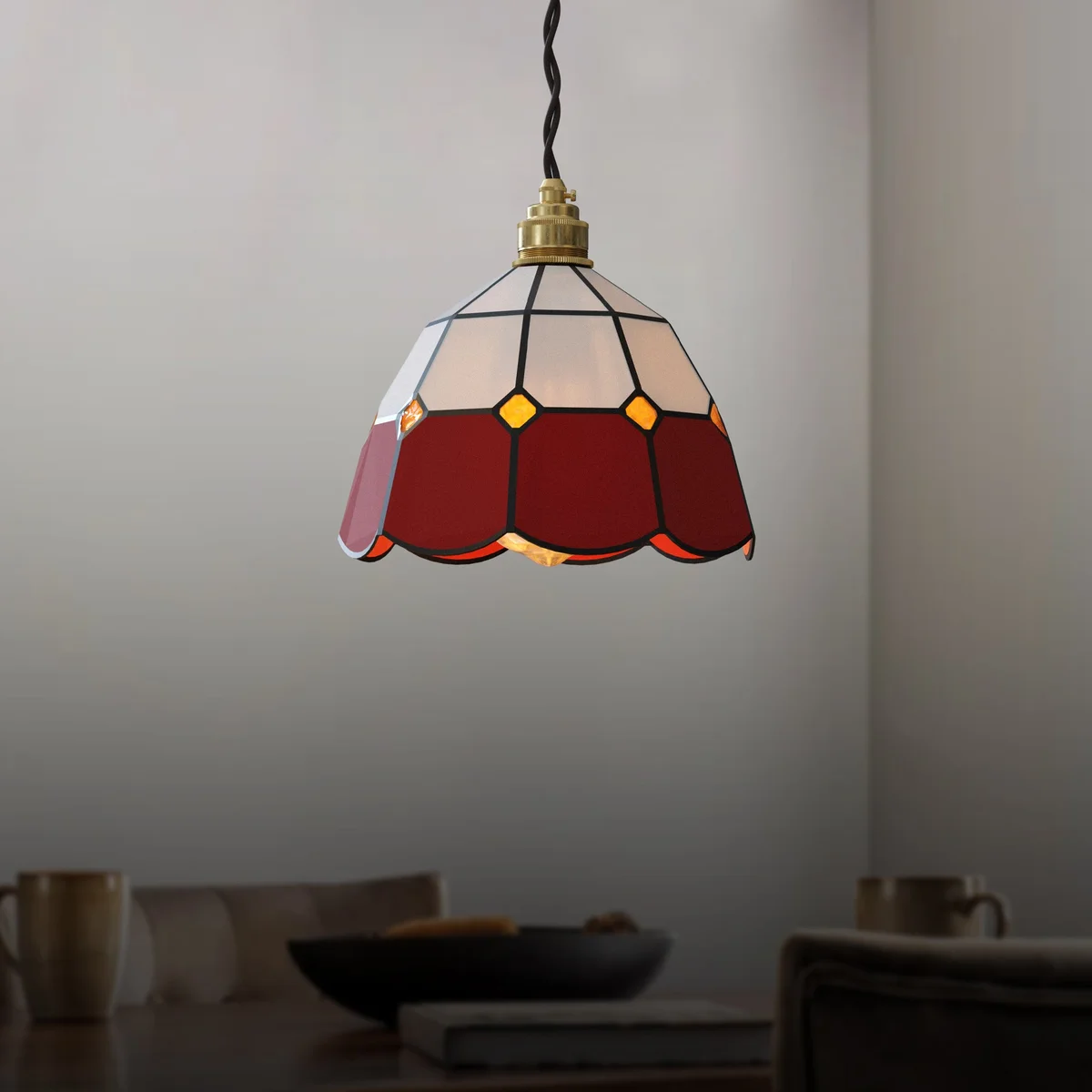 Vibrant Tiffany-style glass shade hangs from a chain, dimmable indoor ceiling light.