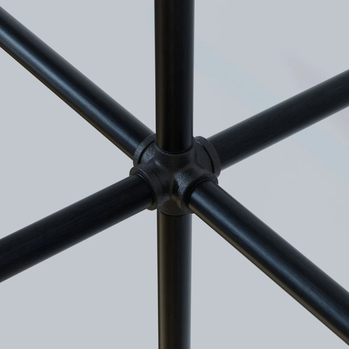 Black painted 3/4 inch BSP malleable iron pipe fitting, part of an industrial lighting fittings collection.