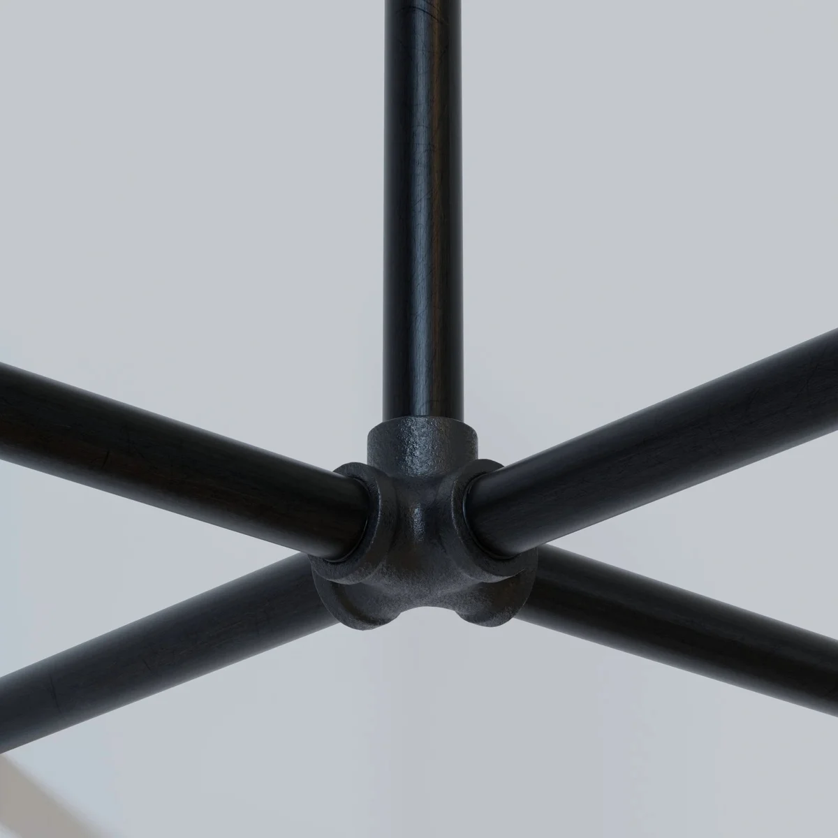 Black pipe fittings: 5‑way cast iron connector, ¾‑inch screw, four threaded holes, central axis, ideal for DIY projects.