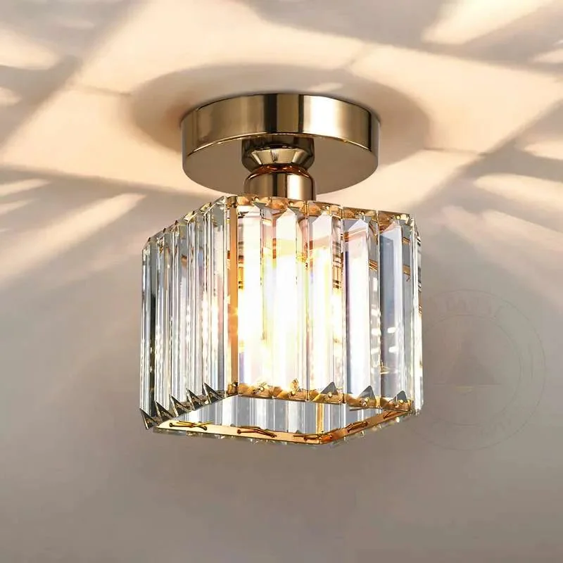 Square crystal pendant ceiling light with gold and black metal frame, flush mounted on ceiling, 13cm square cage.