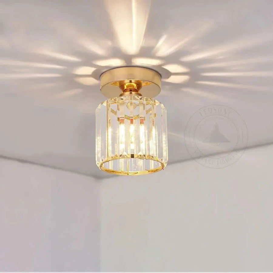 Round crystal ceiling light with metal gold finish, modern semi‑flush mount, LED bulb visible.