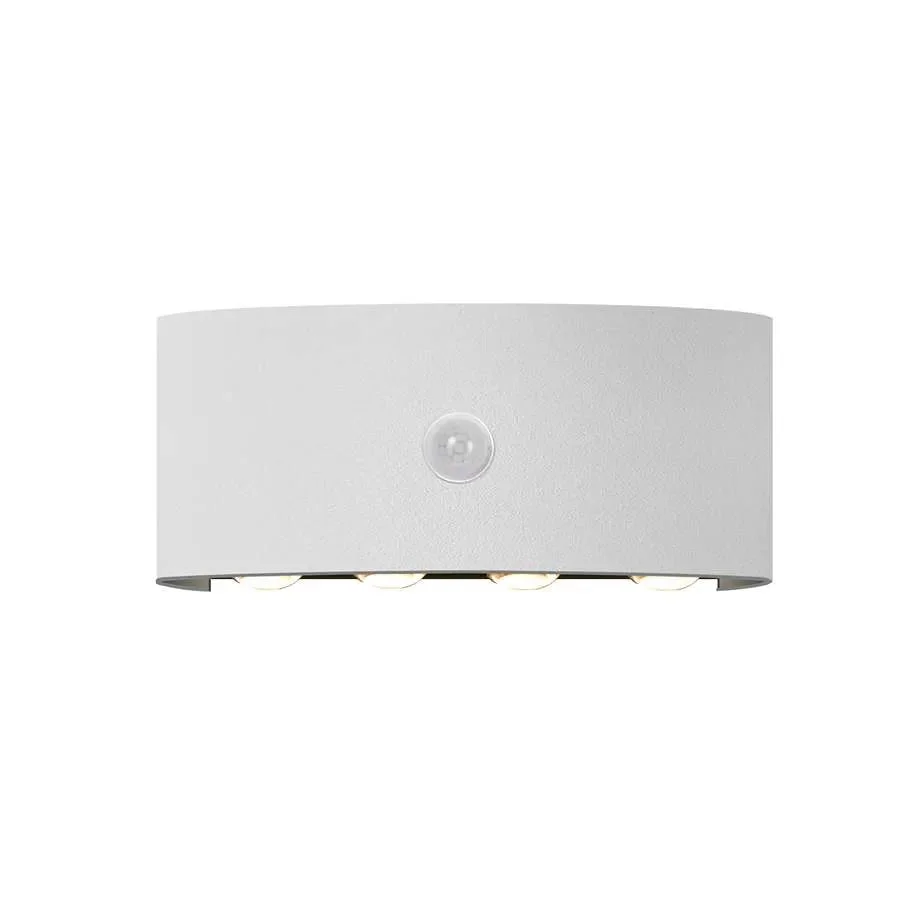 White rectangular motion sensor wall light with integrated LED strip, mounted on a wall, emits warm white glow