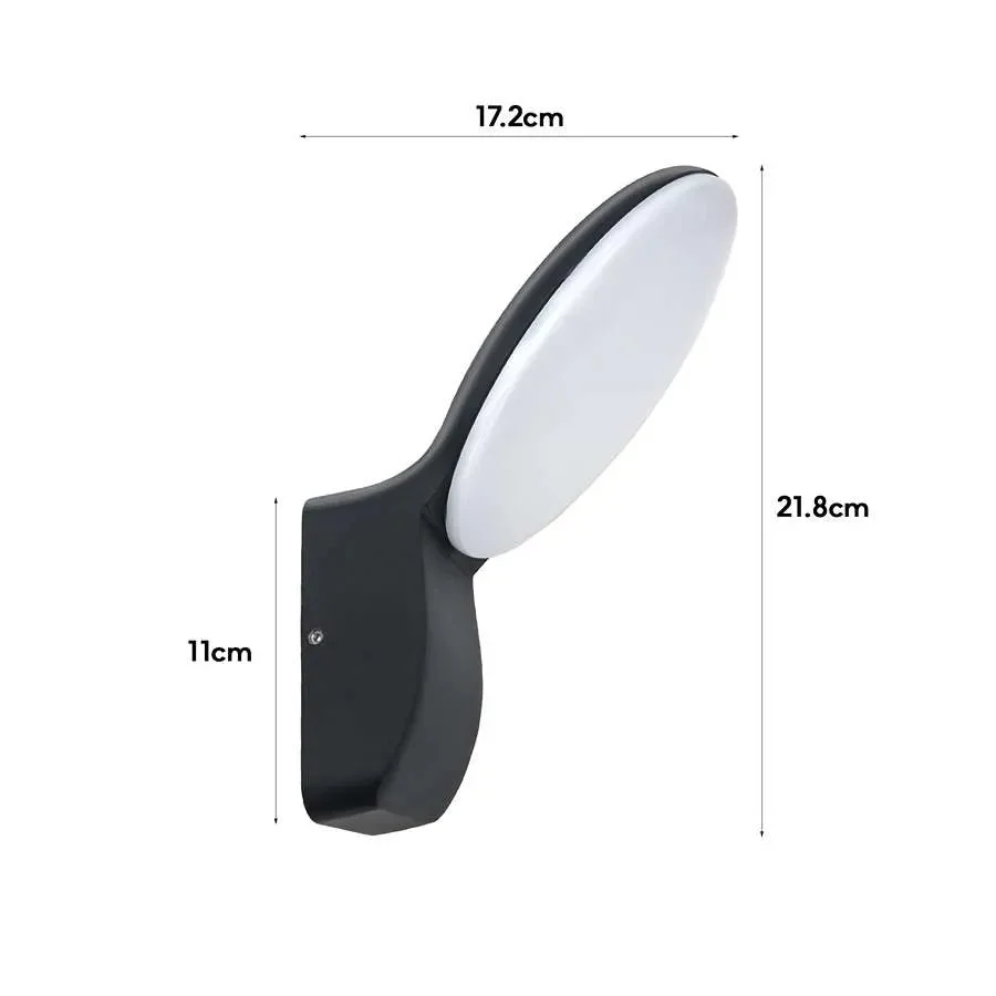 Black die‑cast aluminum outdoor lamp illuminating garden with warm white light.