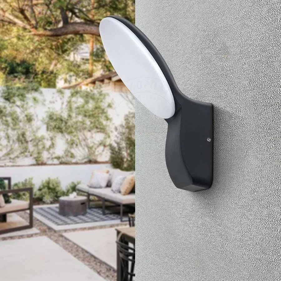 Black die‑cast aluminum LED outdoor wall lamp with warm white light, mounted on a wall, IP54 protected.