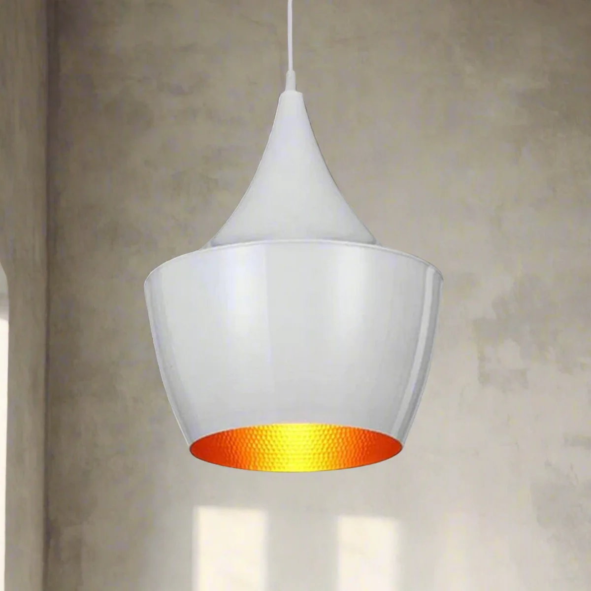 Sleek white metal loft pendant light with gold inner shade hanging from a ceiling rose—modern kitchen pendant lighting.