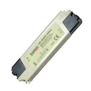 Compact plastic indoor LED power supply, 12 V/7 W, IP44 splashproof, screw‑mount and adhesive options, labeled voltage.