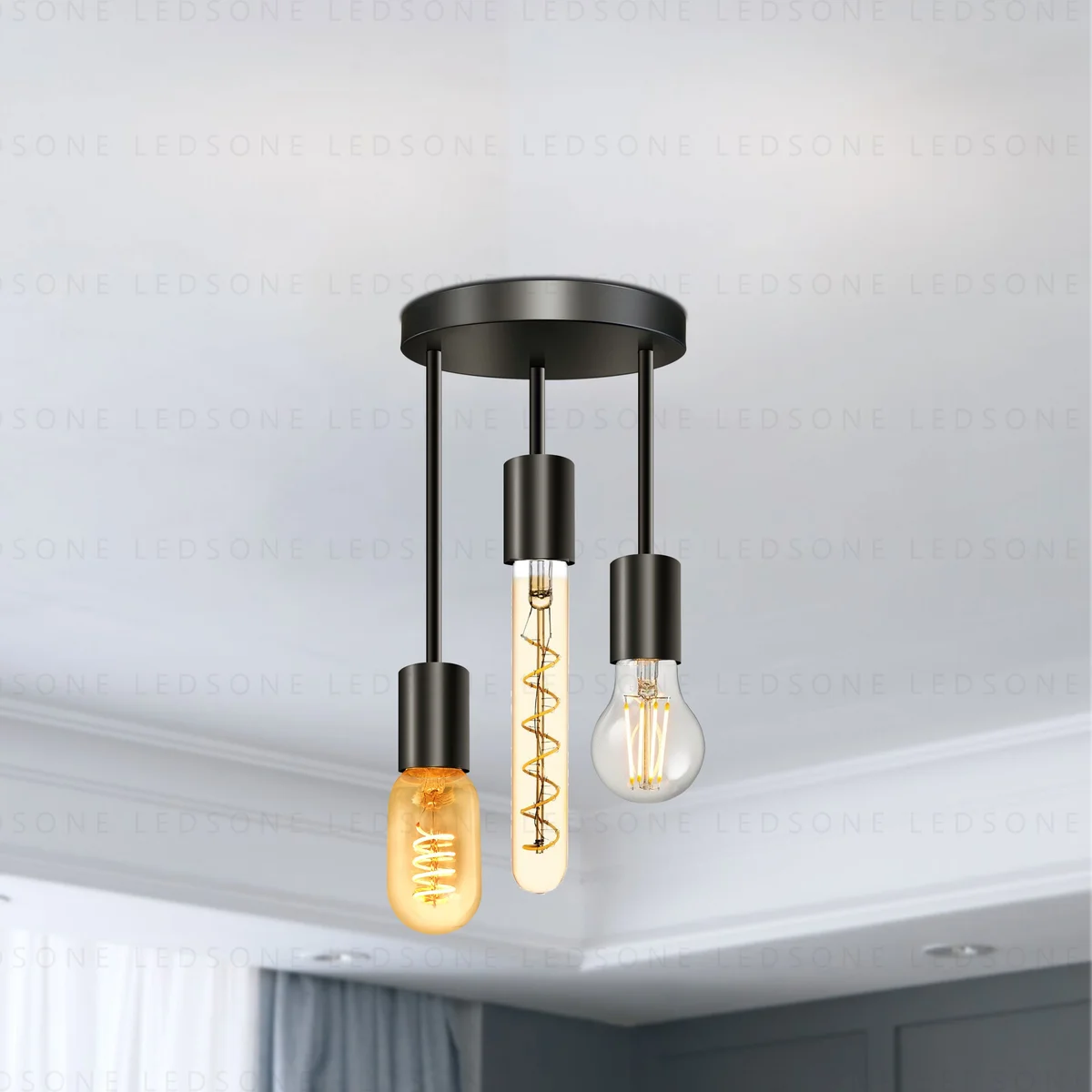 Black 3‑way industrial pendant light with round metal base, featuring sockets for E27 bulbs, suspended from ceiling.