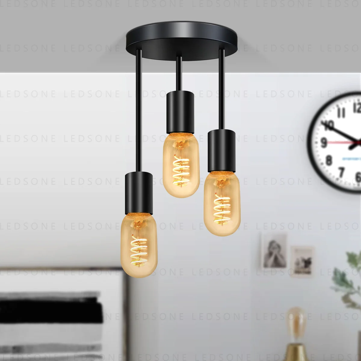 Modern ceiling pendant light with black metal body, three E27 sockets, round base, industrial style.