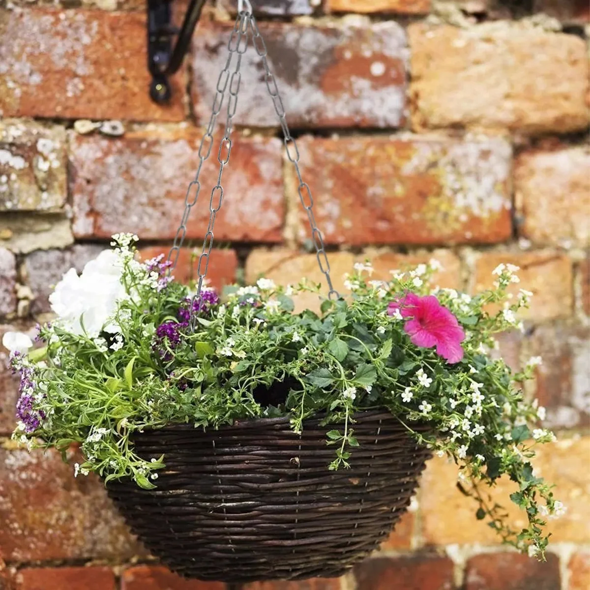 Indoor outdoor light chain in vintage metal with hand‑brushed finish, hanging from a fixture with two connection locks.