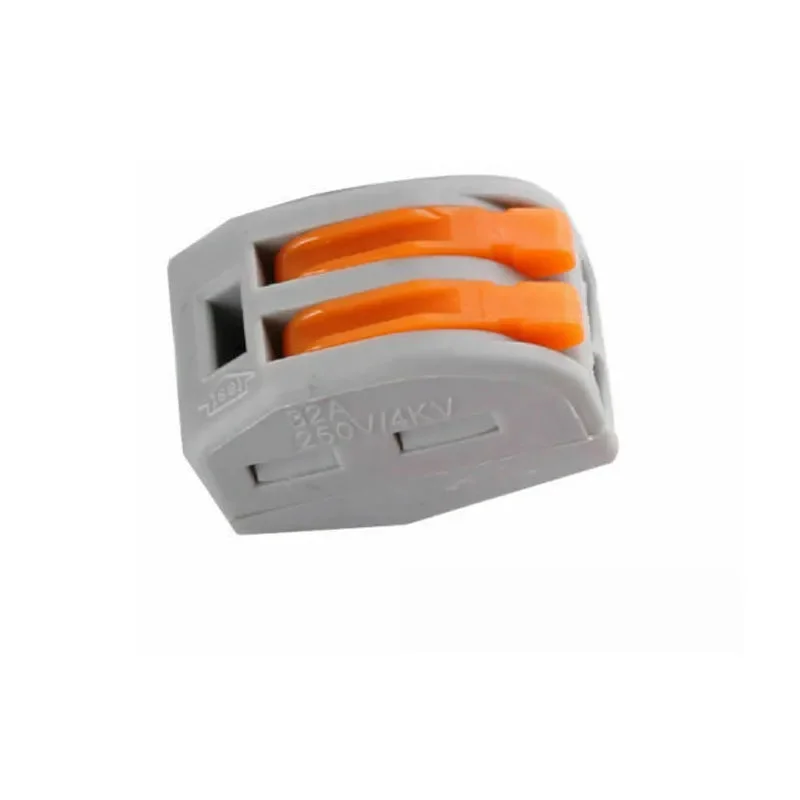 Grey and orange plastic cable clamp with two pins, suitable for lamp shade fittings.