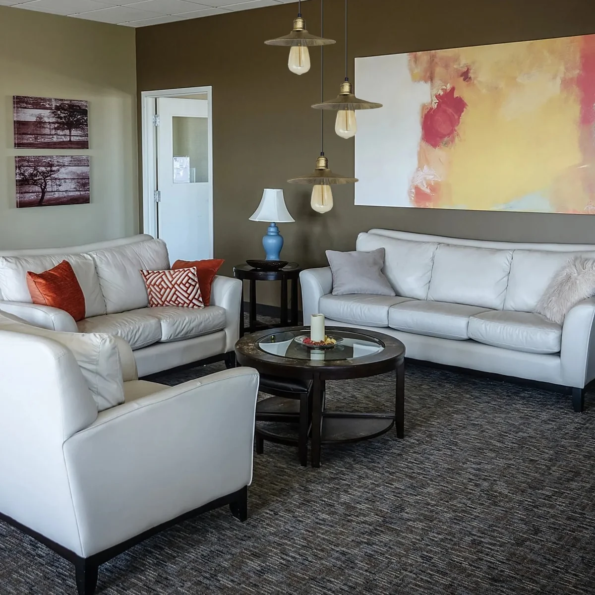 Antique brass pendant light with three metal shades and adjustable cables, showing rustic vintage style.