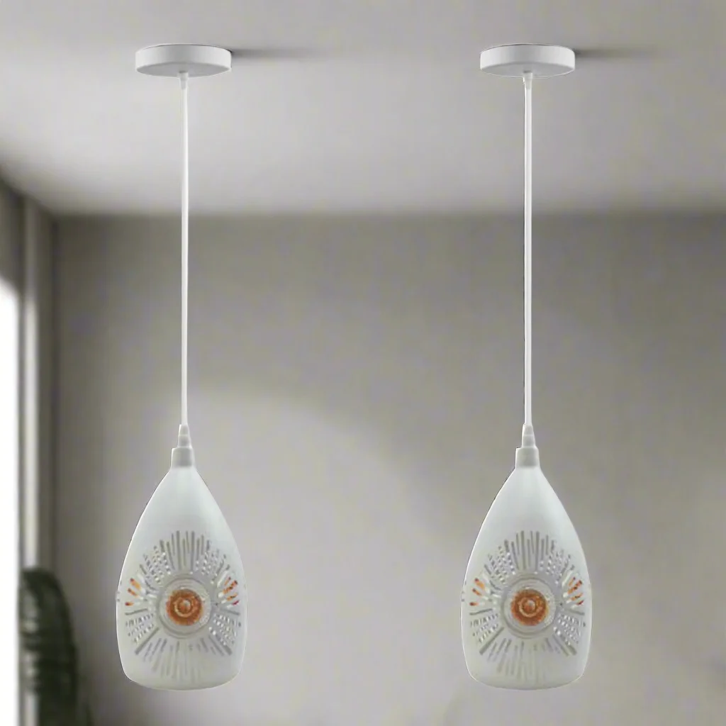 White metal pendant lights in vintage style with white interior shades hanging from a ceiling.