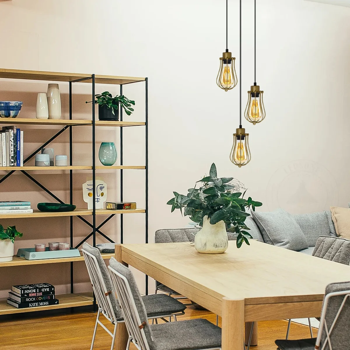 Three vintage yellow brass balloon wire cage light arrangements hanging from a round ceiling plate