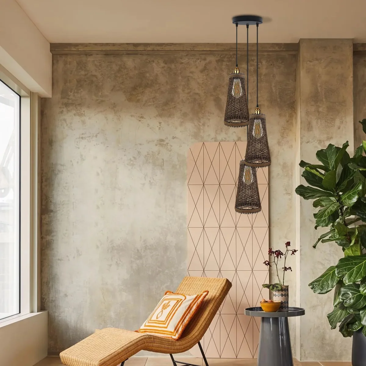 Three‑headed rattan ceiling pendant with metal base hanging on a long cord, vintage style lighting fixture.