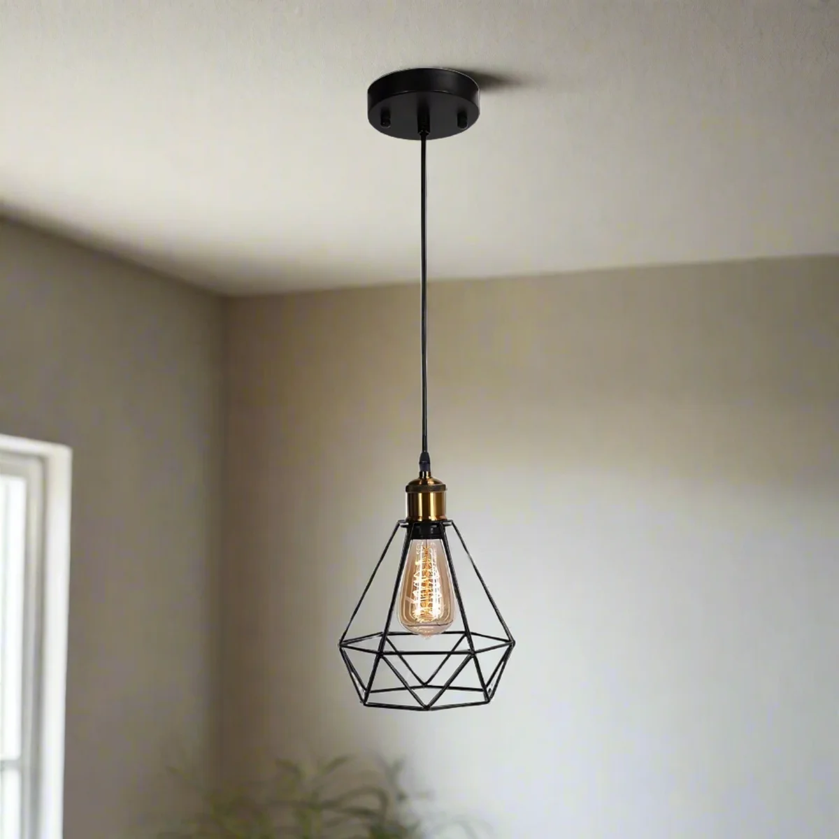 Black metal diamond cage pendant light hanging from ceiling, showing diamond-shaped metal cage and E27 base.