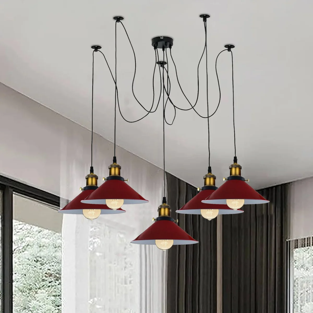 Five‑arm red spider ceiling light with glossy metal arms and red glass shades, hung from a white ceiling.