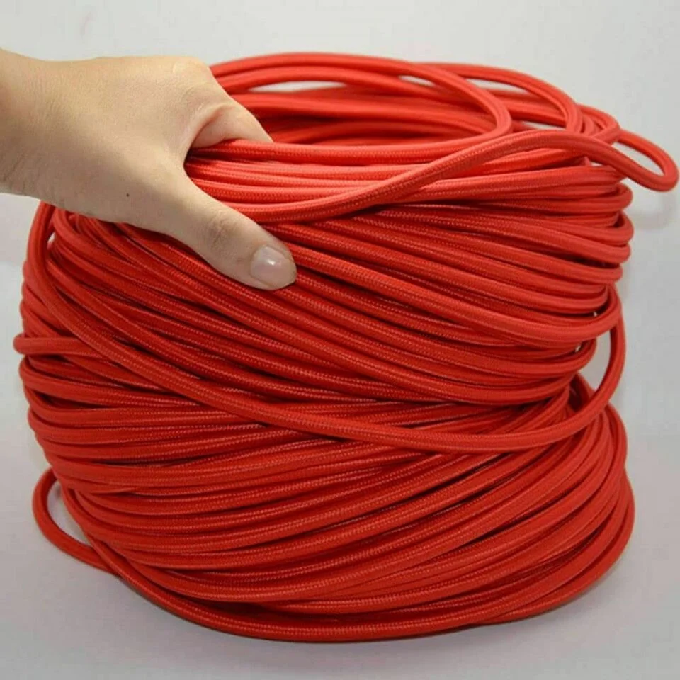 Rolled 10m vintage 3 core cable with braided fabric and 3 visible cores on a neutral background